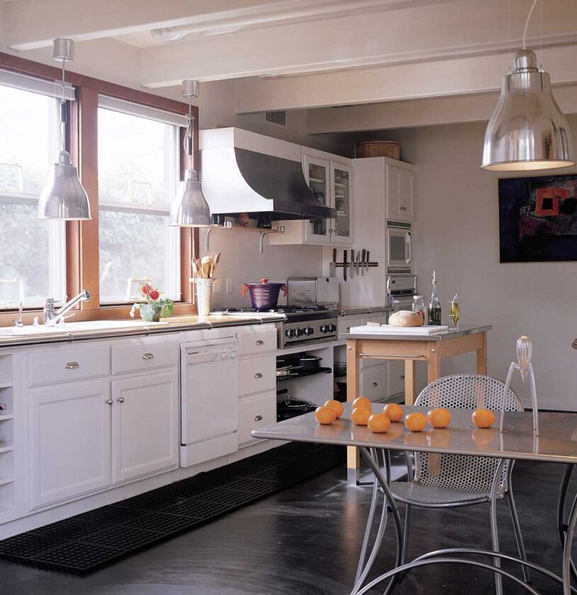Jana loves the charcoal-poured kitchen floor, which acts as a passive solar collector, because